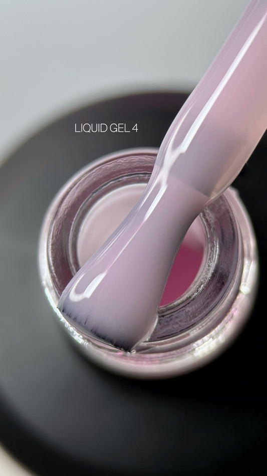 Liquid gel polish in a vibrant pink shade, showcasing a smooth and glossy finish. Ideal for manicured nails.