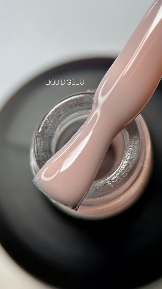 Liquid gel polish in a nude shade, showcasing a smooth and glossy finish suitable for elegant nail designs.